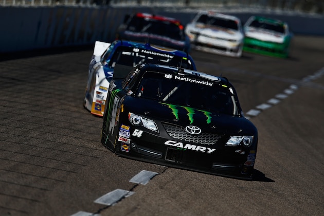 FORT WORTH, TX - NOVEMBER 01:  Kyle Busch, driver of the #54 Monster Energy Toyota, leads a pack of cars during the NASCAR Nationwide Series O'Reilly Auto Parts Challenge at Texas Motor Speedway on November 1, 2014 in Fort Worth, Texas.  (Photo by Brian Lawdermilk/Getty Images for Texas Motor Speedway)