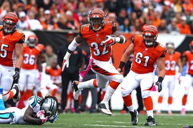 CINCINNATI, OH - OCTOBER 12: Jeremy Hill #32 of the Cincinnati Bengals breaks a tackle by Charles Godfrey #30 of the Carolina Panthers during the third quarter at Paul Brown Stadium on October 12, 2014 in Cincinnati, Ohio. (Photo by Andy Lyons/Getty Images)