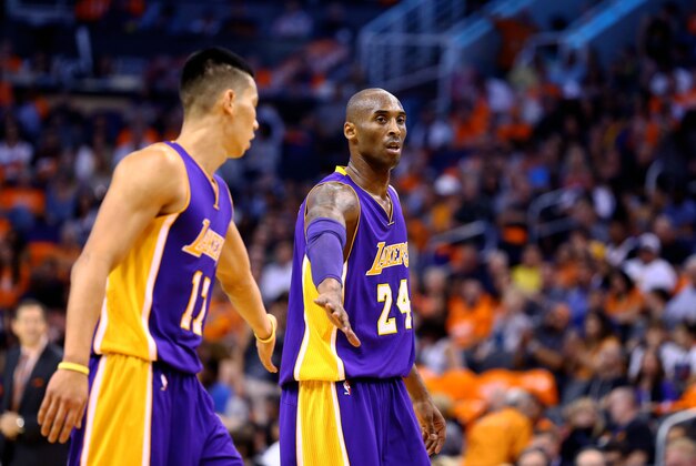Oct 29, 2014; Phoenix, AZ, USA; Los Angeles Lakers guard Kobe Bryant (right) with guard Jeremy Lin against the Phoenix Suns during the home opener at US Airways Center. The Suns defeated the Lakers 119-99. Mandatory Credit: Mark J. Rebilas-USA TODAY Sports