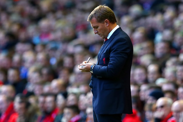 LIVERPOOL, ENGLAND - OCTOBER 25:  Brendan Rodgers, manager of Liverpool makes notes during the Barclays Premier League match between Liverpool and Hull City at Anfield on October 25, 2014 in Liverpool, England.  (Photo by Alex Livesey/Getty Images)