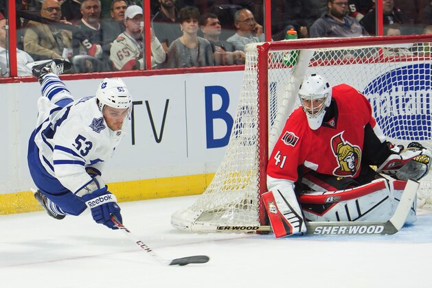 Sep 24, 2014; Ottawa, Ontario, CAN; Toronto Maple Leafs center Sam Carrick (53) shoots on Ottawa Senators goalie Craig Anderson (41) in the first period at the Canadian Tire Centre. Mandatory Credit: Marc DesRosiers-USA TODAY Sports