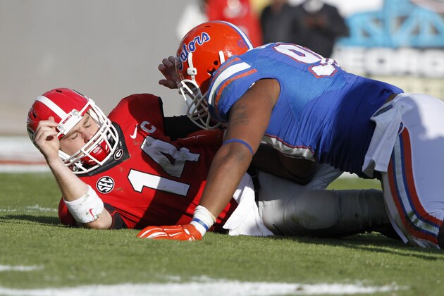 Nov 1, 2014; Jacksonville, FL, USA; Florida Gators defensive lineman Jonathan Bullard (90) pressures Georgia Bulldogs quarterback Hutson Mason (14) during the first half at EverBank Field. Mandatory Credit: Kim Klement-USA TODAY Sports