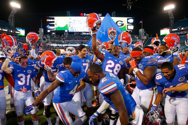 JACKSONVILLE, FL - NOVEMBER 01:  Florida Gators players celebrate following a 38-20 victory over the Georgia Bulldogs at EverBank Field on November 1, 2014 in Jacksonville, Florida.  (Photo by Sam Greenwood/Getty Images)