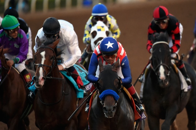 ARCADIA, CA - NOVEMBER 01:  Jockey Martin Garcia atop Bayern (C) leads jockey Victor Espinoza atop California Chrome, and jockey Jamie Spencer atop Toast of New York en route to winning the 2014 Breeders' Cup Classic at Santa Anita Park on November 1, 2014 in Arcadia, California.  (Photo by Kevork Djansezian/Getty Images)