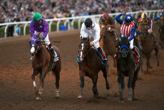 ARCADIA, CA - NOVEMBER 01:  Jockey Martin Garcia atop Bayern (R) celebrates ahead of jockey Victor Espinoza atop California Chrome, and jockey Jamie Spencer atop Toast of New York as he takes the 2014 Breeders' Cup Classic at Santa Anita Park on November 1, 2014 in Arcadia, California.  (Photo by Kevork Djansezian/Getty Images)