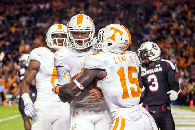 Nov 1, 2014; Columbia, SC, USA; Tennessee Volunteers quarterback Joshua Dobbs (11) and running back Marlin Lane (15) celebrate a touchdown by Dobbs in the second quarter at Williams-Brice Stadium. Mandatory Credit: Jeff Blake-USA TODAY Sports