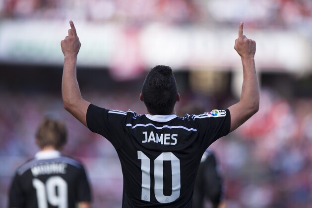 Real Madrid's James Rodriguez from Colombia celebrates his goal during a Spanish La Liga soccer match between Granada and Real Madrid at the Nuevo Los Carmenes stadium in Granada, Spain Saturday Nov. 1, 2014. (AP Photo/Daniel Tejedor)