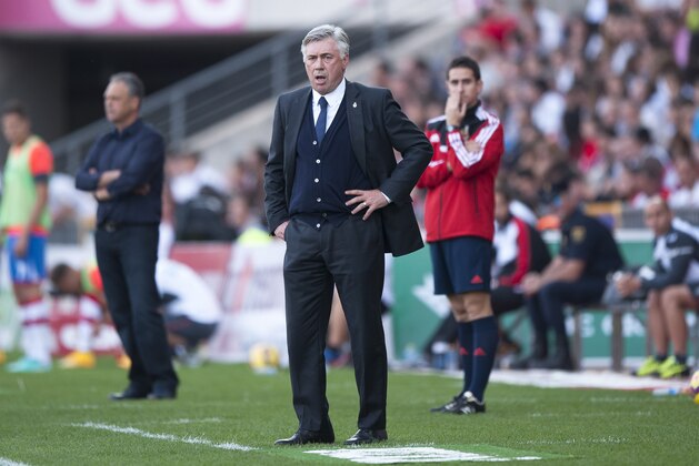 Real Madrid's coach Carlo Ancelotti from Italy gestures during a Spanish La Liga soccer match between Granada and Real Madrid at the Nuevo Los Carmenes stadium in Granada, Spain Saturday Nov. 1, 2014. (AP Photo/Daniel Tejedor)