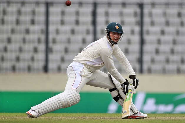 Zimbabwe's captain Brendan Taylor plays a shot during the third day of the first cricket test match against Bangladesh in Dhaka, Bangladesh, Monday, Oct. 27, 2014. (AP Photo/A.M. Ahad)