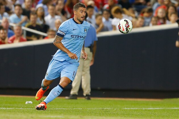 NEW YORK, NY - JULY 30:  Aleksandar Kolarov #11 of Manchester City in action against Liverpool during the International Champions Cup 2014 at Yankee Stadium on July 30, 2014 in the Bronx borough of New York City.  (Photo by Mike Stobe/Getty Images)
