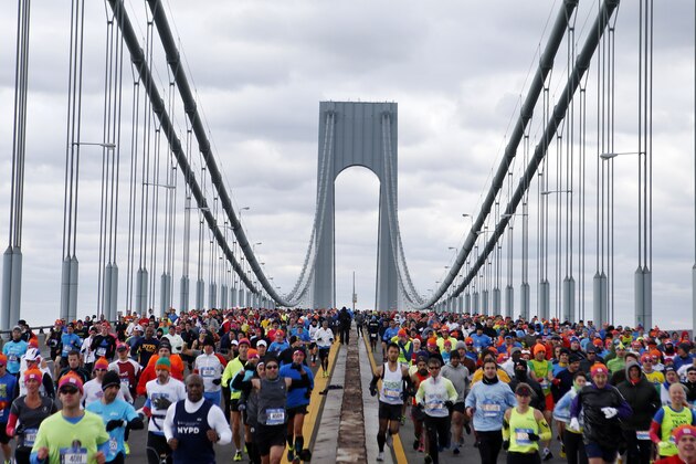 Runners cross the Verrazano-Narrows Bridge at the start of the New York City Marathon, Sunday, Nov. 2, 2014, in New York. (AP Photo/Jason DeCrow)
