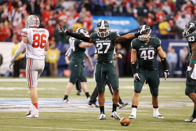 INDIANAPOLIS, IN - DECEMBER 07: Kurtis Drummond #27 of the Michigan State Spartans signals a incomplete pass on fourth down after breaking up a pass intended for Jeff Heuerman #86 of the Ohio State Buckeyes during the Big 10 Conference Championship Game at Lucas Oil Stadium on December 7, 2013 in Indianapolis, Indiana.  Michigan State won the game 34-24. (Photo by Gregory Shamus/Getty Images)