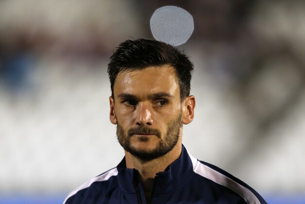 France's Hugo Lloris stands during the playing of his country's national anthem before the start of their international friendly soccer match against Serbia, in Belgrade, Serbia, Sunday, Sept. 7, 2014. (AP Photo/Darko Vojinovic)