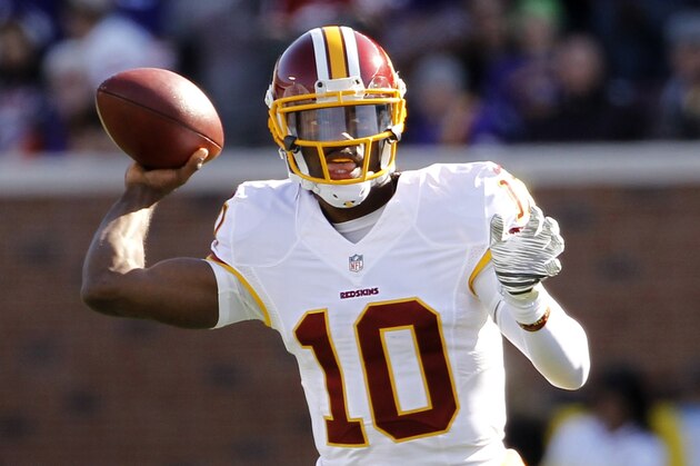 Washington Redskins quarterback Robert Griffin III throws a pass during the first half of an NFL football game against the Minnesota Vikings, Sunday, Nov. 2, 2014, in Minneapolis. (AP Photo/Ann Heisenfelt)