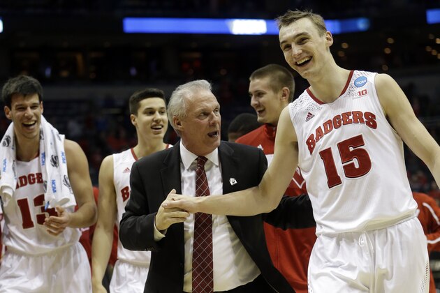 Wisconsin head coach Bo Ryan celebrates with Wisconsin forward Sam Dekker (15) after  a third-round game against the Oregon in the NCAA college basketball tournament Saturday, March 22, 2014, in Milwaukee. Wisconsin won 82-77. (AP Photo/Morry Gash)