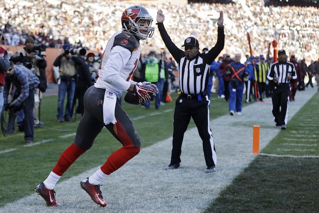 Tampa Bay Buccaneers wide receiver Mike Evans runs back to the bench after a touchdown catch against the Cleveland Browns in the third quarter of an NFL football game Sunday, Nov. 2, 2014, in Cleveland. (AP Photo/Tony Dejak)