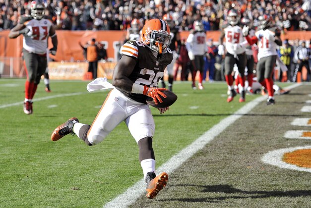 Cleveland Browns running back Terrance West (28) runs untouched into the end zone on a touchdown catch against the Tampa Bay Buccaneers in the third quarter of an NFL football game Sunday, Nov. 2, 2014, in Cleveland. (AP Photo/David Richard)