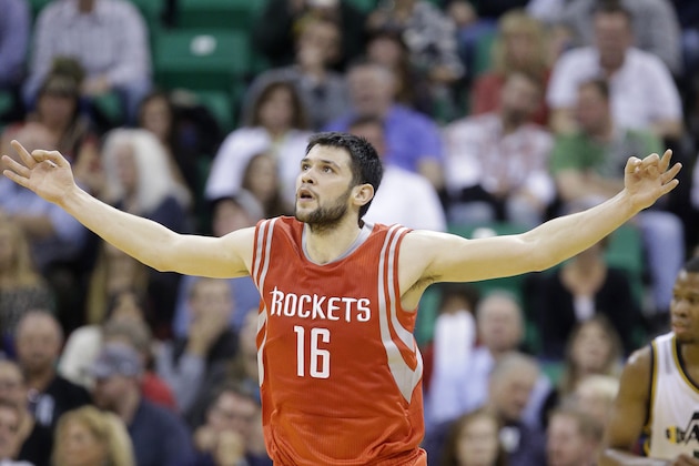 Houston Rockets' Kostas Papanikolaou celebrates after hitting a 3-point shot in the first half during an NBA basketball game against the Utah Jazz, Wednesday, Oct. 29, 2014, in Salt Lake City. (AP Photo/Rick Bowmer)