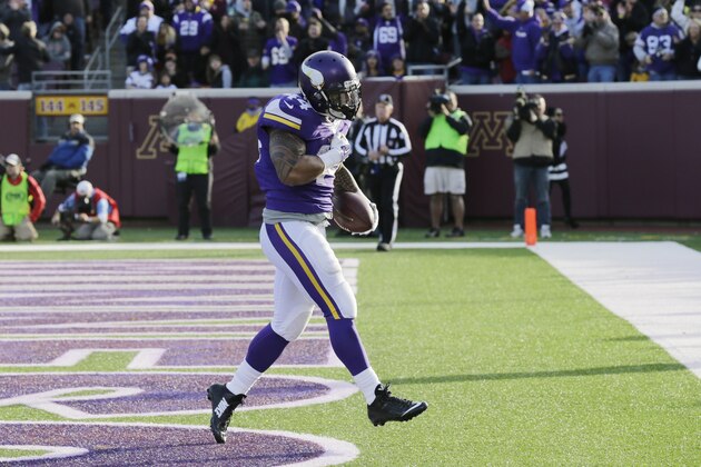 Minnesota Vikings running back Matt Asiata celebrates after scoring on a 1-yard touchdown run in the fourth quarter of an NFL football game against the Washington Redskins, Sunday, Nov. 2, 2014, in Minneapolis. (AP Photo/Ann Heisenfelt)