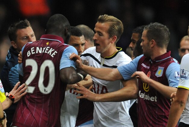 Aston Villa's Christian Benteke, left, and Tottenham's Harry Kane, second left, react during the English Premier League soccer match between Aston Villa and Tottenham Hotspur at Villa Park, Birmingham, England, Sunday, Nov. 2, 2014. (AP Photo/Rui Vieira)