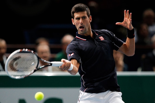 PARIS, FRANCE - NOVEMBER 01:  Novak Djokovic of Serbia in action against against Kei Nishikori of Japan in their semi final match during day 6 of the BNP Paribas Masters held at the at Palais Omnisports de Bercy on November 1, 2014 in Paris, France.  (Photo by Dean Mouhtaropoulos/Getty Images)