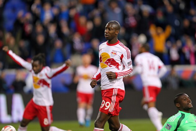 New York Red Bulls Bradley Wright-Phillips celebrates after scoring a goal against D.C. United goalkeeper Bill Hamid during the first half of an MLS playoff soccer match, Sunday, Nov. 2, 2014, in Harrison, N.J. (AP Photo/Adam Hunger)