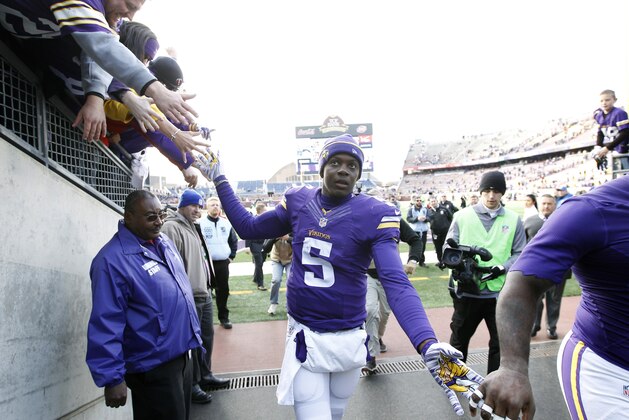 Minnesota Vikings quarterback Teddy Bridgewater celebrates with fans after an NFL football game against the Washington Redskins, Sunday, Nov. 2, 2014, in Minneapolis. The Vikings won 29-26. (AP Photo/Ann Heisenfelt)