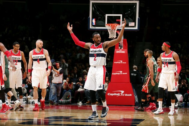 WASHINGTON, DC - NOVEMBER 1: John Wall #2 of the Washington Wizards celebrates during a game against the Milwaukee Bucks at the Verizon Center on November 1, 2014 in Washington, DC. NOTE TO USER: User expressly acknowledges and agrees that, by downloading and or using this photograph, User is consenting to the terms and conditions of the Getty Images License Agreement. (Photo by Ned Dishman/NBAE via Getty Images)