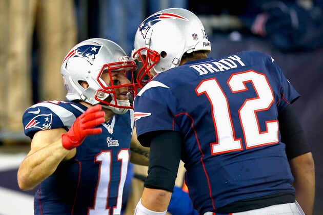 FOXBORO, MA - NOVEMBER 02:  Julian Edelman #11 of the New England Patriots reacts alongside Tom Brady #12 after returning a kick for a touchdown during the second quarter against the Denver Broncos at Gillette Stadium on November 2, 2014 in Foxboro, Massachusetts.  (Photo by Jared Wickerham/Getty Images)