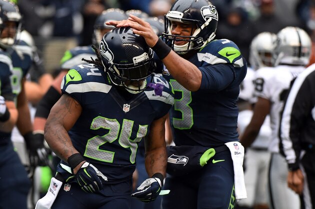 SEATTLE, WA - NOVEMBER 02: Quarterback Russell Wilson #3 of the Seattle Seahawks celebrates with running back Marshawn Lynch #24 of the Seattle Seahawks after Lynch scored a touchdown during the first quarter of the game against the Oakland Raiders at CenturyLink Field on November 2, 2014 in Seattle, Washington.  (Photo by Steve Dykes/Getty Images)