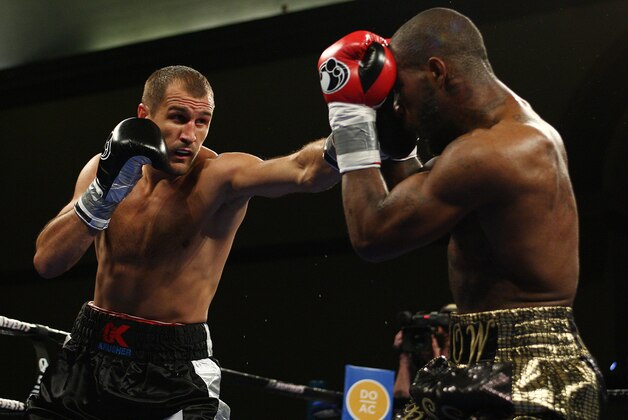 Sergey Kovalev, left, of Russia punches Cedric Agnew of Chicago, IL during the first round of WBO Light Heavyweight Championship boxing in Atlantic City, N.J. on Saturday, March 29, 2014. Kovalev won by knockout in the seventh round. (AP Photo/Tim Larsen)