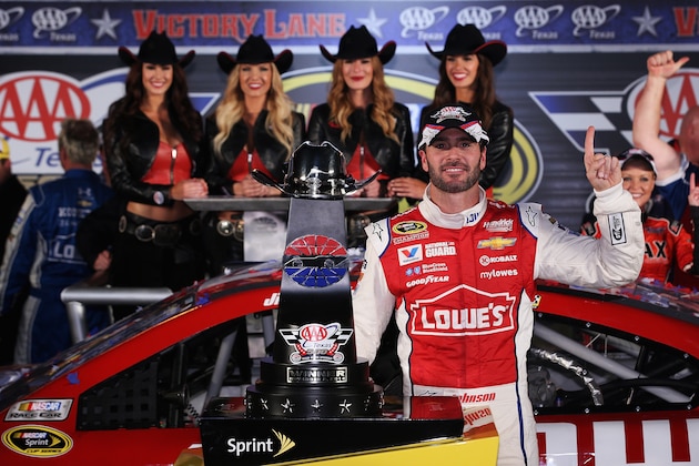 FORT WORTH, TX - NOVEMBER 02:  Jimmie Johnson, driver of the #48 Lowe's Red Vest Chevrolet, celebrates with the trophy in Victory Lane after winning during the NASCAR Sprint Cup Series AAA Texas 500 at Texas Motor Speedway on November 2, 2014 in Fort Worth, Texas.  (Photo by Chris Graythen/Getty Images for Texas Motor Speedway)