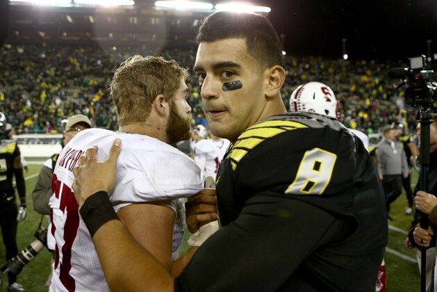 Oregon quarterback Marcus Mariota (8) shakes hands after an NCAA college football game against Stanford in Eugene, Ore., Saturday, Nov. 1, 2014. (AP Photo/Ryan Kang)