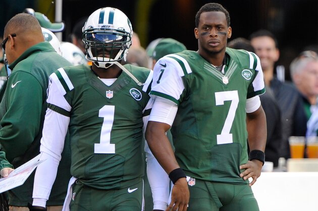 Oct 26, 2014; East Rutherford, NJ, USA; New York Jets quarterback Geno Smith (7) stands beside quarterback Michael Vick (1) after being benched in the first half against the Buffalo Bills at MetLife Stadium. Mandatory Credit: Robert Deutsch-USA TODAY Sports