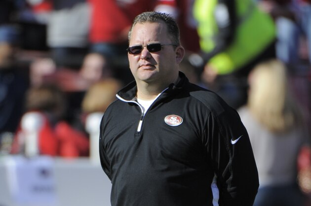 December 30, 2012; San Francisco, CA, USA; San Francisco 49ers offensive coordinator Greg Roman watches warm ups before the game against the Arizona Cardinals at Candlestick Park. Mandatory Credit: Kyle Terada-USA TODAY Sports