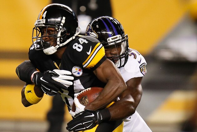 PITTSBURGH, PA - NOVEMBER 02:  Antonio Brown #84 of the Pittsburgh Steelers gets tackled by C.J. Mosley #57 of the Baltimore Ravens at Heinz Field on November 2, 2014 in Pittsburgh, Pennsylvania.  (Photo by Gregory Shamus/Getty Images)