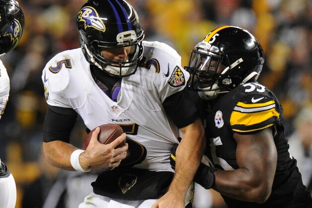 Baltimore Ravens quarterback Joe Flacco (5) is sacked by Pittsburgh Steelers outside linebacker Arthur Moats (55) in the second quarter of the NFL football game, Sunday, Nov. 2, 2014, in Pittsburgh. (AP Photo/Don Wright)