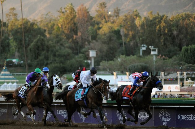 ARCADIA, CA - NOVEMBER 01:  Jockey Martin Garcia atop Bayern (L) leads jockey Victor Espinoza atop California Chrome, and jockey Jamie Spencer atop Toast of New York en route to winning the 2014 Breeders' Cup Classic at Santa Anita Park on November 1, 2014 in Arcadia, California.  (Photo by Harry How/Getty Images)