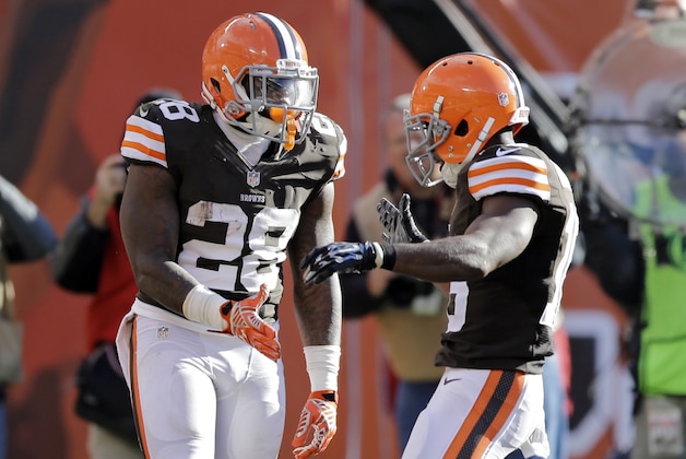 Cleveland Browns running back Terrance West (28) celebrates his touchdown catch in the third quarter of an NFL football game Sunday, Nov. 2, 2014, in Cleveland. (AP Photo/Tony Dejak)