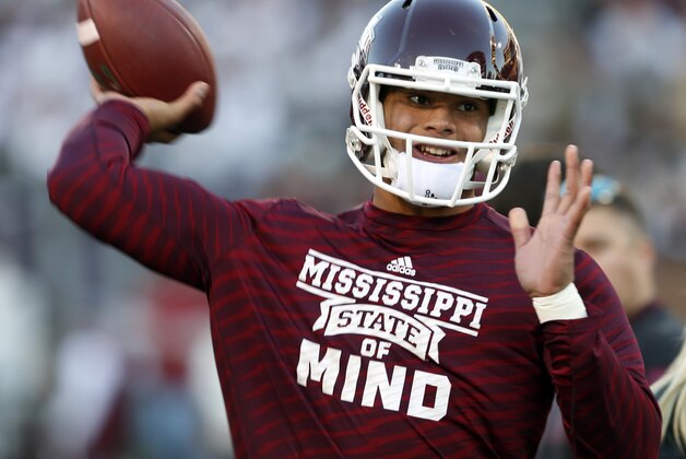 STARKVILLE, MS - NOVEMBER 1:  Dak Prescott, quarterback of the Mississippi State Bulldogs, warms up before the game against Arkansas at Davis Wade Stadium on November 1, 2014, in Starkville, Mississippi. (Photo by Butch Dill/Getty Images)