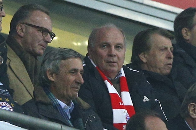 Bayern CEO Karlheinz Rummenigge, left, and president Uli Hoeness watch the Champions League round of 16 second leg soccer match between FC Bayern Munich and FC Arsenal in Munich, Germany, Tuesday, March 11, 2014. (AP Photo/Matthias Schrader)