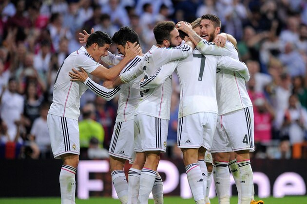 MADRID, SPAIN - OCTOBER 25:  James Rodriguez (L) of Real Madrid celebrates with Isco after Real scored their 3rd goal  during the La Liga match between Real Madrid CF and FC Barcelona at Estadio Santiago Bernabeu on October 25, 2014 in Madrid, Spain.  (Photo by Denis Doyle/Getty Images)