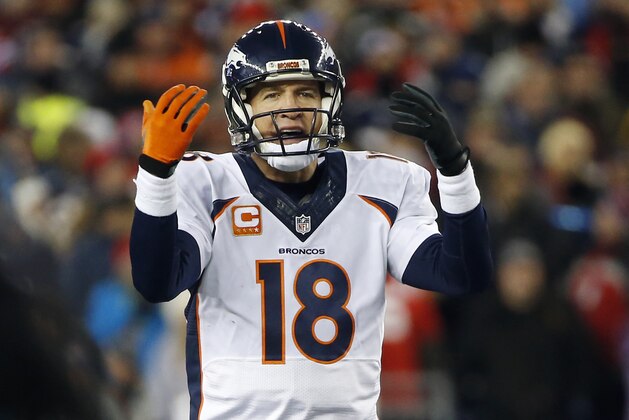 Denver Broncos quarterback Peyton Manning (18) signals in the first half an NFL football game against the New England Patriots on Sunday, Nov. 2, 2014, in Foxborough, Mass. (AP Photo/Elise Amendola)