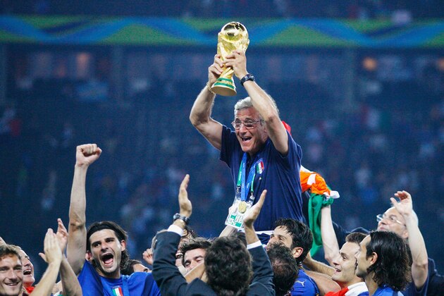 BERLIN - JULY 09:  The Italian players celebrate as Marcello Lippi the coach of Italy lifts the World Cup trophy aloft following his team's victory in a penalty shootout at the end of the FIFA World Cup Germany 2006 Final match between Italy and France at the Olympic Stadium on July 9, 2006 in Berlin, Germany.  (Photo by Shaun Botterill/Getty Images)