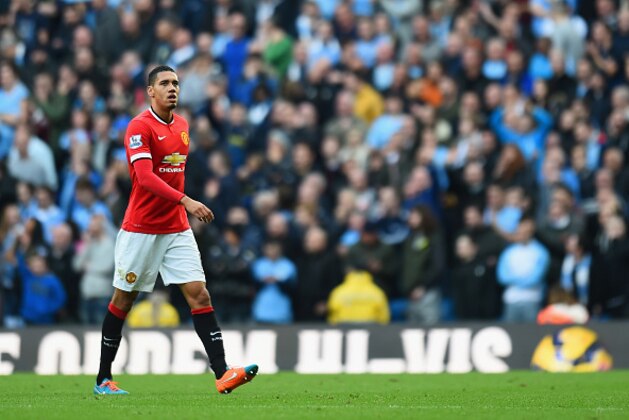 MANCHESTER, ENGLAND - NOVEMBER 02:  Chris Smalling of Manchester United leaves the field after receiving a red card during the Barclays Premier League match between Manchester City and Manchester United at Etihad Stadium on November 2, 2014 in Manchester, England.  (Photo by Shaun Botterill/Getty Images)