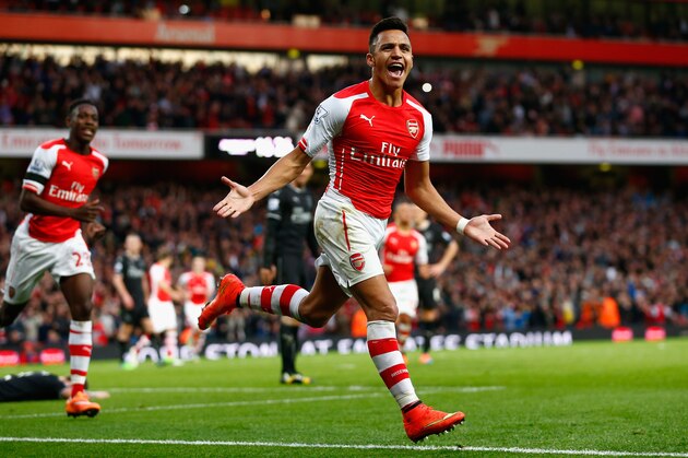 LONDON, ENGLAND - NOVEMBER 01:  Alexis Sanchez of Arsenal celebrates scoring the first goal during the Barclays Premier League match between Arsenal and Burnley at Emirates Stadium on November 1, 2014 in London, England.  (Photo by Julian Finney/Getty Images)