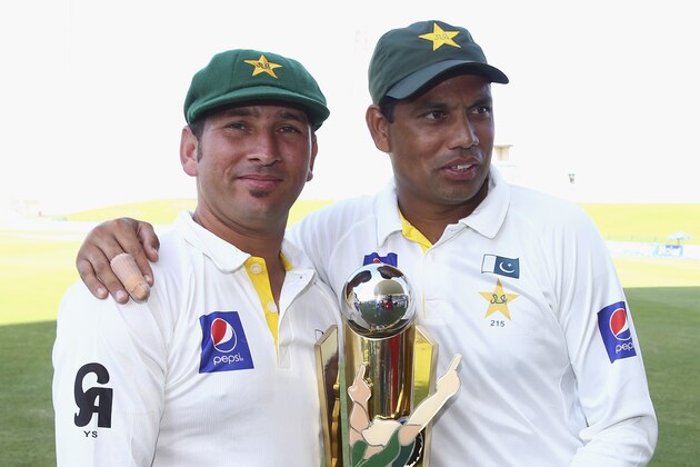 ABU DHABI, UNITED ARAB EMIRATES - NOVEMBER 03:  Yasir Shah and Zulfiqar Babar of Pakistan  celebrate with the trophy after Pakistan won the series 2-0 during Day Five of the Second Test between Pakistan and Australia at Sheikh Zayed Stadium on November 3, 2014 in Abu Dhabi, United Arab Emirates.  (Photo by Ryan Pierse/Getty Images)