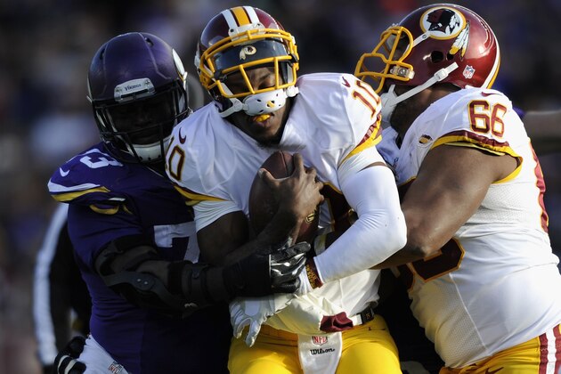 MINNEAPOLIS, MN - NOVEMBER 2: Sharrif Floyd #73 of the Minnesota Vikings stops the progress of Robert Griffin III #10 of the Washington Redskins during the fourth quarter of the game on November 2, 2014 at TCF Bank Stadium in Minneapolis, Minnesota. The Vikings defeated the Redskins 29-26. (Photo by Hannah Foslien/Getty Images)
