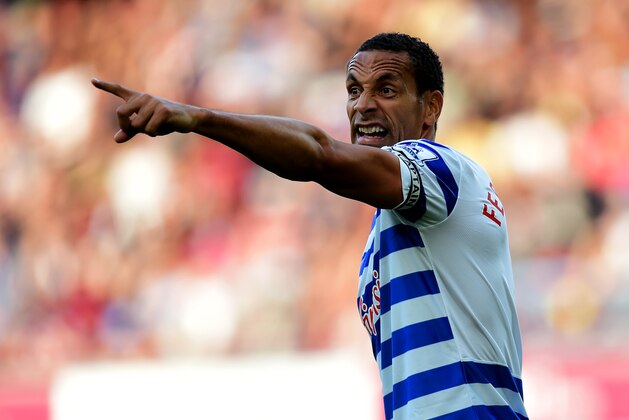 LONDON, ENGLAND - OCTOBER 05:  Rio Ferdinand of QPR signals during the Barclays Premier League match between West Ham United and Queens Park Rangers at Boleyn Ground on October 5, 2014 in London, England.  (Photo by Jamie McDonald/Getty Images)