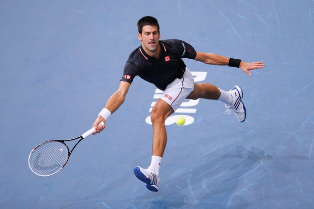 PARIS, FRANCE - NOVEMBER 02:  Novak Djokovic of Serbia in action against Milos Raonic of Canada in their Final match during day 7 of the BNP Paribas Masters held at the at Palais Omnisports de Bercy on November 2, 2014 in Paris, France.  (Photo by Dean Mouhtaropoulos/Getty Images)